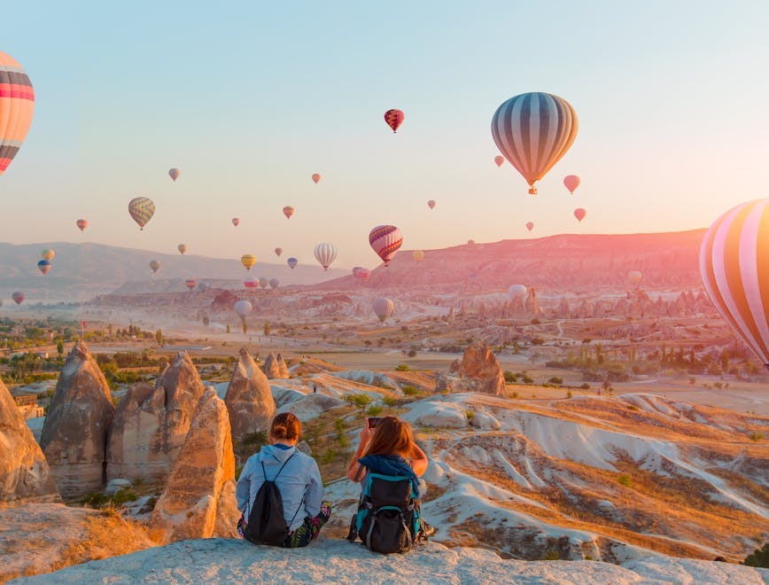 flight,couple,sunrise,woman,balloons,happy,destination,tourism,air,formation,experience,geology,hot,geological,rock,tourist,beautiful,mountain,view,national,ballon,park,capadocia,cappadocia,sky,balloon,famous,nature,old,history,girl,ancient,people,adventure,outdoor,hill,fly,ballooning,nevsehir,turkey,vacations,spectacular,valley,travel,colorful,landscape backpack bag balloon person aircraft transportation vehicle hot air balloon